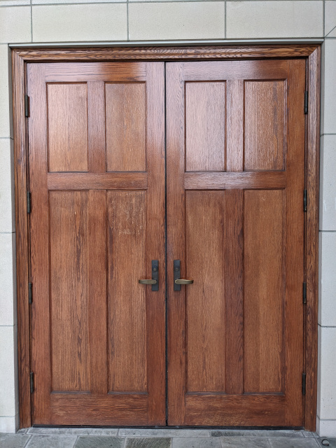 A pair of fancy, but rather bland, wooden doors